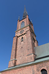 Fototapeta na wymiar Riddarholmen Church clock tower in a sunny day, Stockholm, Sweden.