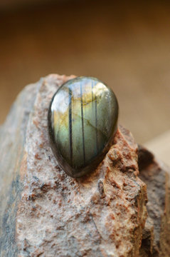 labradorite gemstone on rock
