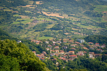 Fototapeta na wymiar Panorama of Republic of San Marino and Italy from Monte Titano, City of San Marino. City of San Marino is capital city of Republic of San Marino located on Italian peninsula, near Adriatic Sea.