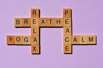 Yoga, Breathe, Relax, Peace, Calm, crossword in wooden alphabet letters in crossword form isolated...