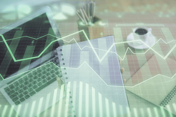 Double exposure of businesswoman hands typing on computer and forex chart hologram drawing. Financial analysis concept.