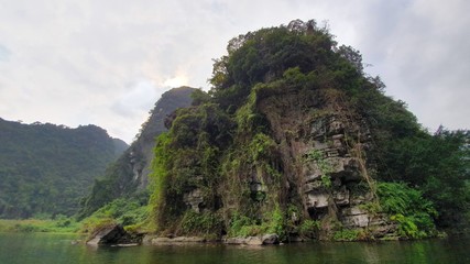Fototapeta na wymiar Trang An - Vietnam canoe ride next t Skull Island film site for King Kong movie