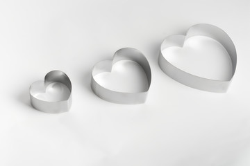 metal mold in the form of heart on a white background.isolated photo