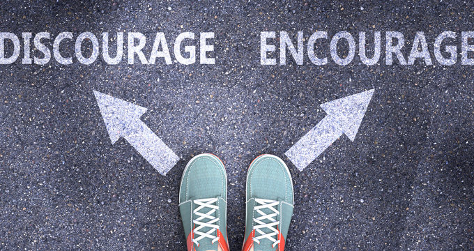 Discourage and encourage as different choices in life - pictured as words Discourage, encourage on a road to symbolize making decision and picking either one as an option, 3d illustration