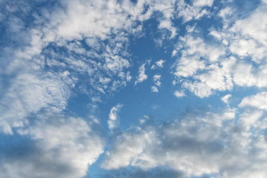  Hi resolution image of a cloudy blue sky with multiple clouds. 