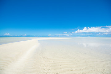 Fototapeta na wymiar Long beach, white sand road in the blue ocean, Ngerkeklau island, Ngarchelong state, Palau, Pacific