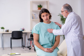 Fototapeta premium Young male patient visiting experienced doctor