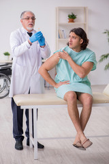 Young male patient visiting experienced doctor