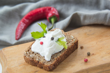Delicious bread with spices, chili peppers, herbs and cheese cream