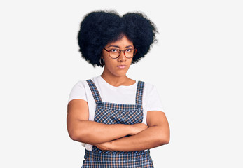 Young african american girl wearing casual clothes skeptic and nervous, disapproving expression on face with crossed arms. negative person.