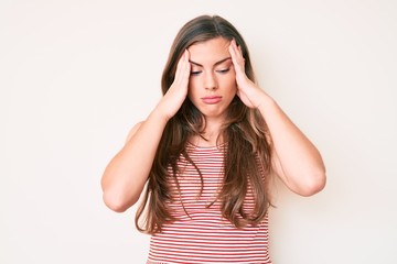 Beautiful young caucasian woman wearing casual clothes suffering from headache desperate and stressed because pain and migraine. hands on head.