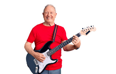 Senior handsome grey-haired man playing electric guitar looking positive and happy standing and smiling with a confident smile showing teeth