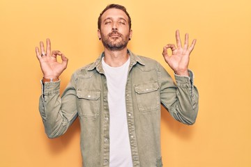 Young handsome man wearing casual clothes relax and smiling with eyes closed doing meditation gesture with fingers. yoga concept.