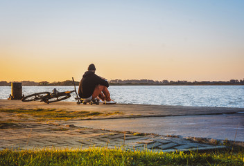 Man enjoying the sunset on the docks in southern Brazil