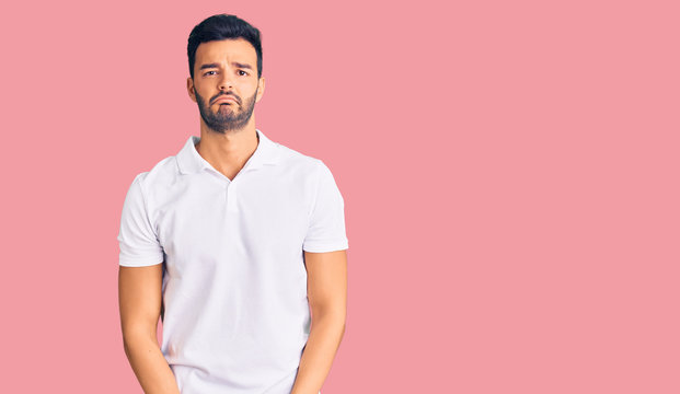 Young handsome hispanic man wearing casual clothes depressed and worry for distress, crying angry and afraid. sad expression.