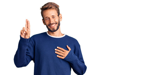 Handsome blond man with beard wearing casual sweater smiling swearing with hand on chest and...