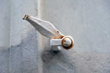 Shutter hook in a small town in France.