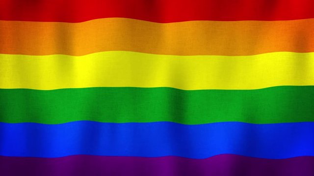 LGBT Pride Rainbow flag waving in the wind. Lesbian Gay Bisexual Transgender. Closeup in 4k of realistic LGBT flag with highly detailed fabric texture. Rainbow love concept. Human rights and tolerance