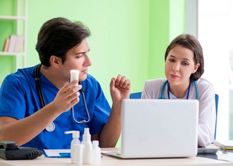 Woman and man doctors radiologists working at the clinic