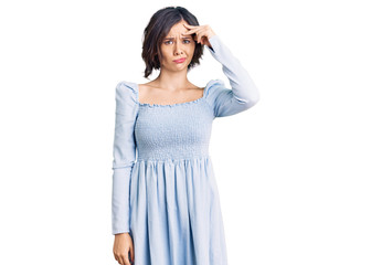 Young beautiful girl wearing casual clothes worried and stressed about a problem with hand on forehead, nervous and anxious for crisis