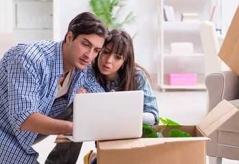 Young family moving in to new apartment after paying off mortgag