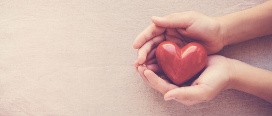 hands holding red heart, health care, love, organ donation, family insurance,CSR,world heart day,...