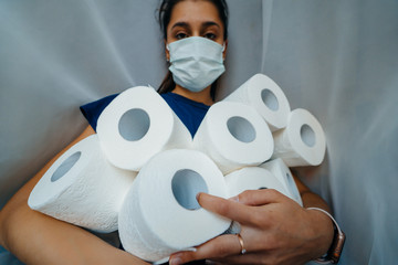 People are stocking up toilet paper for home quarantine from coronavirus.