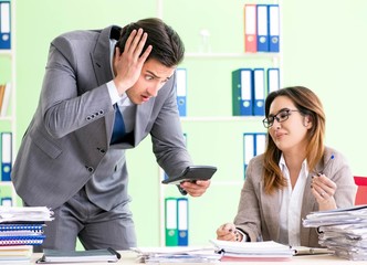 Two financial specialists working in the office