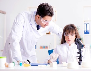 Two lab doctor testing food products