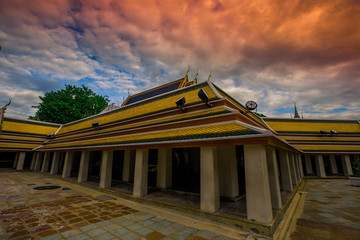 Obraz premium background of important religious attractions in Bangkok (Wat Phra Chetuphon (Wat Pho - reclining Buddha), a large pagoda and beautiful sculptural art give future generations to explore its history