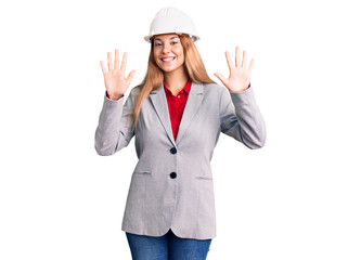 Beautiful young woman wearing architect hardhat showing and pointing up with fingers number ten while smiling confident and happy.