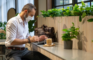 Confidence Caucasian business man typing on digital tablet with internet for online working in...
