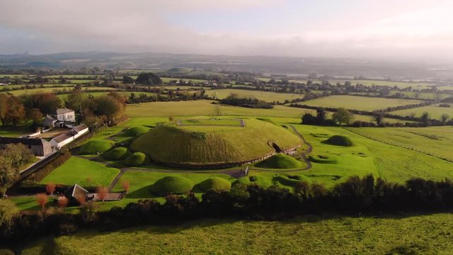 Knowth neolitic tomb aerial birds eye shot of complex located at Bru Na Boinne, River Boyne valley, Ireland. Day sunny light.