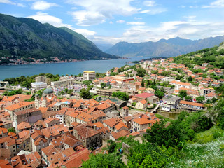 Naklejka na ściany i meble Aerial view of Kotor bay and old city in Kotor, Montenegro. Kotor is a coastal town in a secluded Gulf of Kotor, its preserved medieval old town is an UNESCO World Heritage Site. 