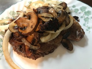 Steak with mushrooms and onions dinner