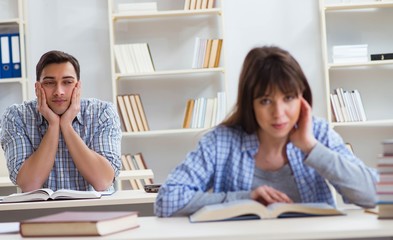 Students sitting and studying in classroom college