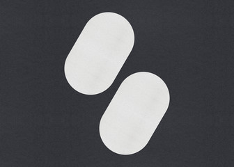 Blank white Business card mockup stacks on grey textured paper background.