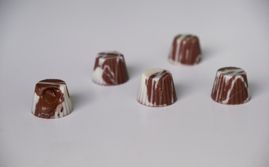dark chocolate, milk chocolate and white chocolate bonbons. filled with peanut butter, dulce de leche, condensed milk and hazelnut cream