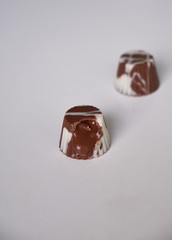 dark chocolate, milk chocolate and white chocolate bonbons. filled with peanut butter, dulce de leche, condensed milk and hazelnut cream