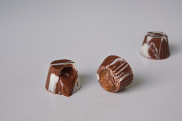 dark chocolate, milk chocolate and white chocolate bonbons. filled with peanut butter, dulce de leche, condensed milk and hazelnut cream