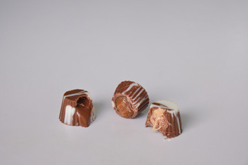 dark chocolate, milk chocolate and white chocolate bonbons. filled with peanut butter, dulce de leche, condensed milk and hazelnut cream