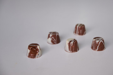 dark chocolate, milk chocolate and white chocolate bonbons. filled with peanut butter, dulce de leche, condensed milk and hazelnut cream