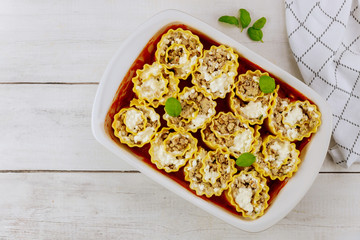Tasty lunch italian pasta in baking tray.