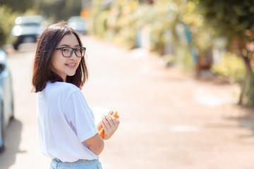 Portrait of student asian woman wearing braces smile with white teeth.