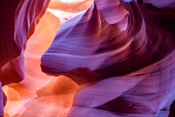 Labyrinths of natural landscape of Lower Antelope Canyon in Page Arizona with bright sandstones stacked in flaky fiery raging waves