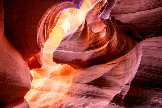 Labyrinths of natural landscape of Lower Antelope Canyon in Page Arizona with bright sandstones stacked in flaky fire waves