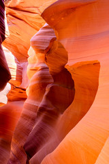 Natural landscape tourists dream in Lower Antelope Canyon in Page Arizona with bright sandstones stacked in flaky fire waves in a narrow sandy labyrinth with caves