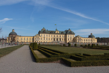 Fototapeta na wymiar Drottningholm, Sweden - April 21 2019: the front view of Drottningholm palace in a sunny day on April 21 2019 in Drottningholm Sweden.