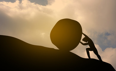 Silhouette of man push stone up to peak hill. Work hard and succeed concept.