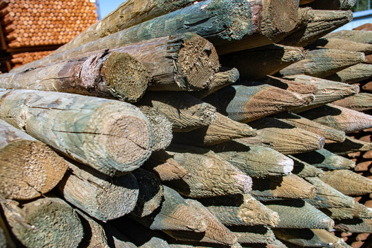 stack of reclaimed pointed fence posts